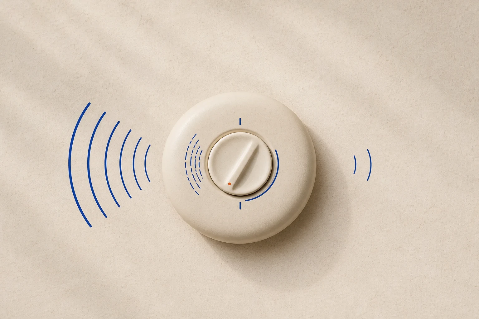 A cream ceramic volume dial with loud cobalt sound waves on one side and quiet waves on the other, representing a signal turned up or down.
